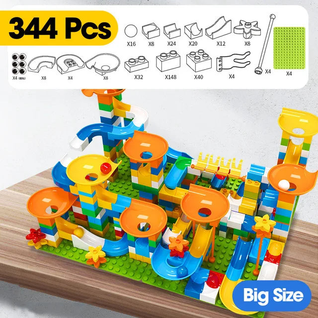 Colorful marble race run toy with funnels, slides, and blocks, featuring blue, orange, and green pieces on a wooden surface.