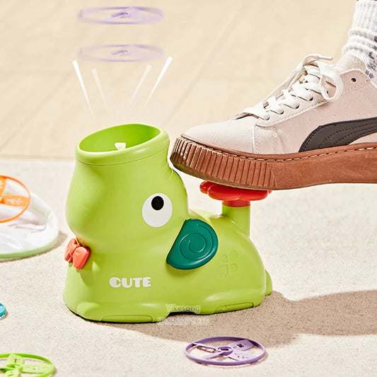 Green kids flying disc launcher toy with duck-shaped body and purple flying disc