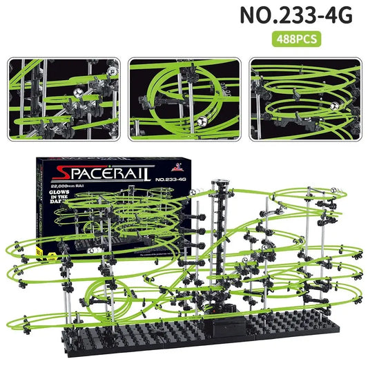 Luminous marble run maze with green tracks, black supports, and electric elevator, featuring multiple levels and designs.