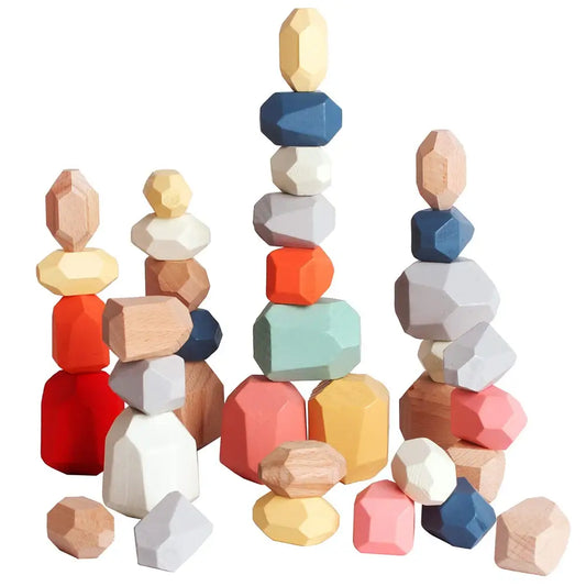 Colorful wooden stacking rocks in various shapes and sizes, including red, blue, yellow, and natural wood tones.