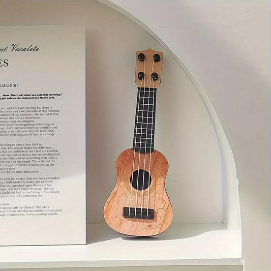 Mini classical ukulele guitar toy with a wooden body and black strings, displayed on a white background.