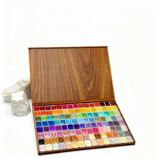 Wooden box containing 120 glitter watercolor paints in various vibrant colors, with a smooth, polished finish.