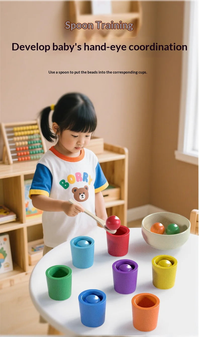 Colorful wooden sorting cups in various colors on a table, with a child using a spoon to match beads.