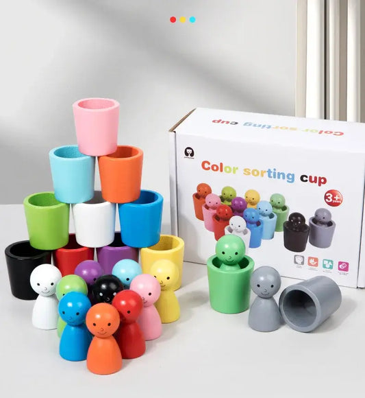 Colorful stacking cups and figures in various shapes, arranged with a box labeled 'Color sorting cup' in the background.