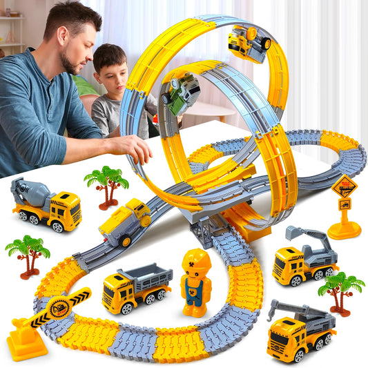 Electric track car set with orange loop tracks, construction vehicles, and driver figurine