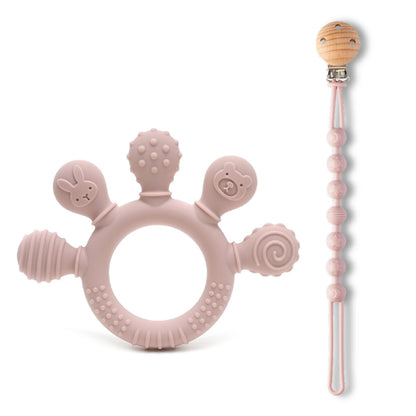 Blush pink silicone baby teether with textured surfaces and shapes, alongside a matching bead soother.