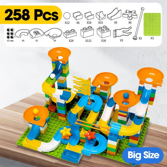 Colorful building blocks arranged in a marble race run with funnels and slides, featuring orange and blue elements.
