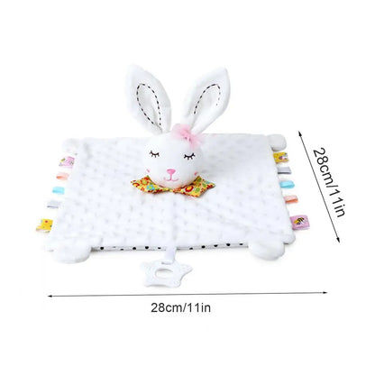 Plush rabbit comforter with a white blanket, featuring colorful tags and a bow tie on the bunny's head.