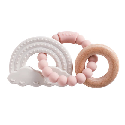 Silicone teether featuring a rainbow and cloud design in pastel colors with a wooden ring and pink beads.