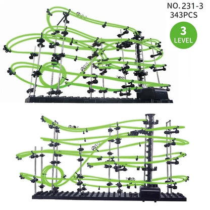 Three-level marble run maze with green tubes and black base, featuring multiple tracks and connectors.