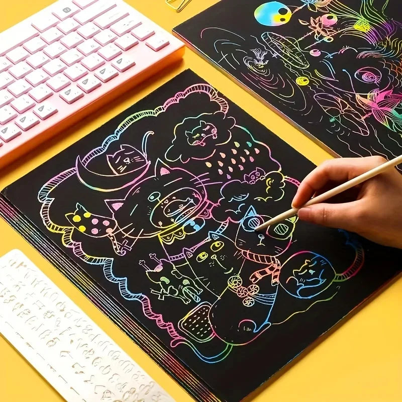 Colorful scratch paper sheets with black backgrounds, featuring various designs and a hand using a stylus.
