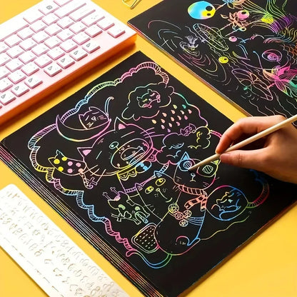 Colorful scratch paper sheets with black backgrounds, featuring various designs and a hand using a stylus.