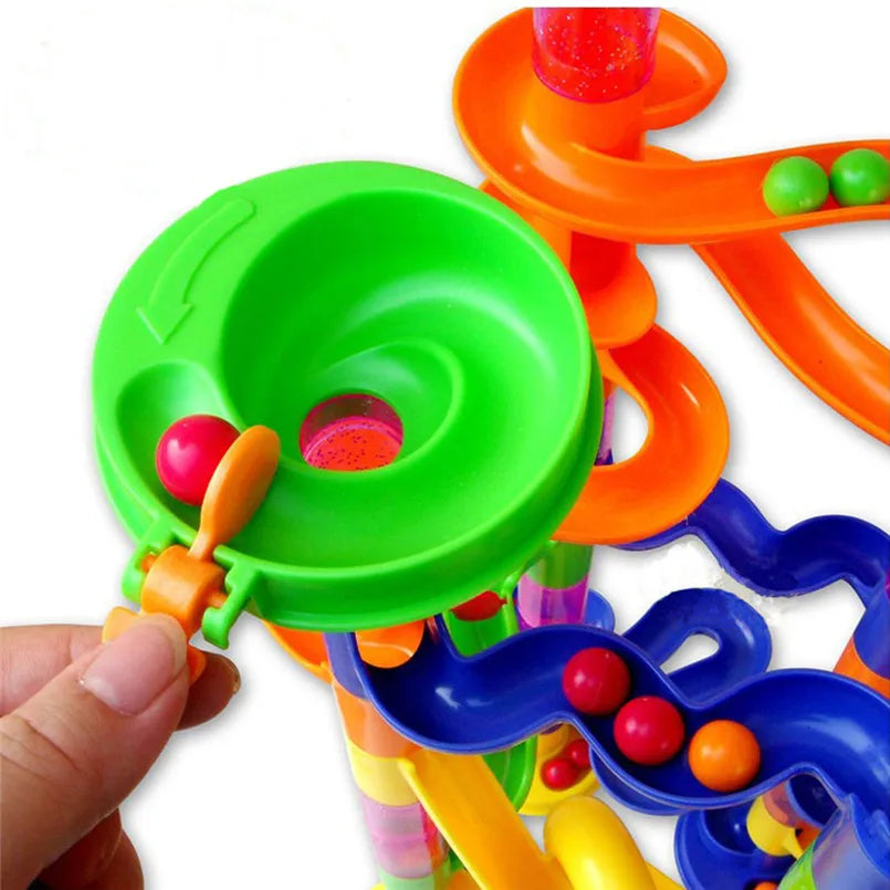 Colorful marble run building blocks with various curved tracks and a funnel, designed for kids' play.