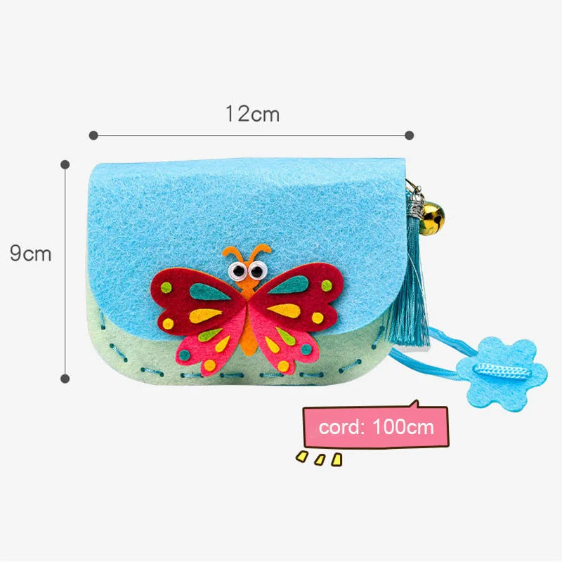 Blue and green felt crossbody purse with a butterfly design, tassel, and flower charm, measuring 12cm by 9cm.