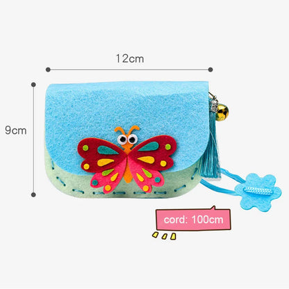 Blue and green felt crossbody purse with a butterfly design, tassel, and flower charm, measuring 12cm by 9cm.