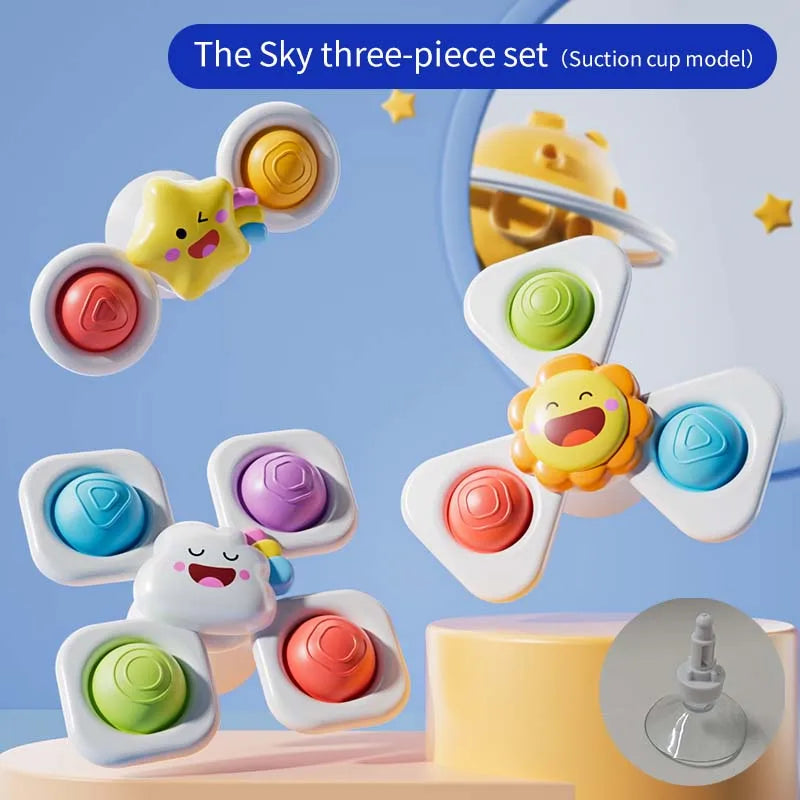 Three colorful suction cup spinning top toys featuring cartoon animal designs, with a watch band option visible.