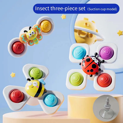 Three-piece insect spinner toy set with suction cups, featuring a bee, ladybug, and colorful buttons on a pastel background.