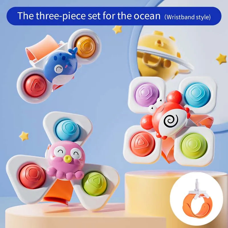 Three colorful suction cup spinning top toys featuring cartoon animals, with a watch band attachment.