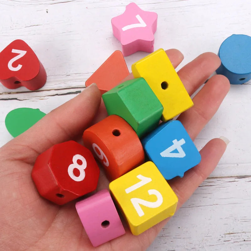 Colorful wooden number blocks in various shapes held in a hand, featuring numbers and vibrant colors.