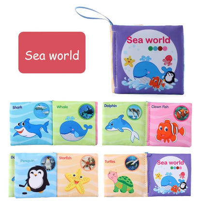 Colorful baby cloth book set featuring ocean-themed pages with animals like sharks, dolphins, and penguins.
