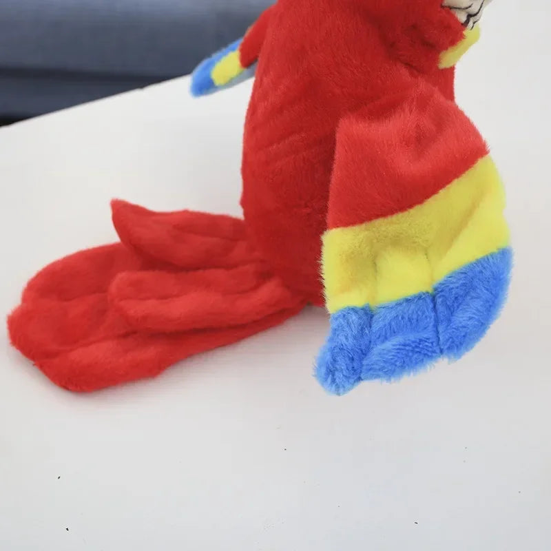 Colorful stuffed macaw parrot plush toy with red, yellow, and blue details, designed to speak and repeat sounds.