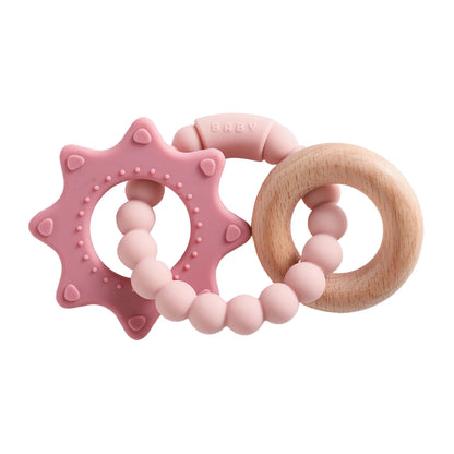Silicone teething ring in pink and natural wood, featuring a star shape and round beads for sensory play.