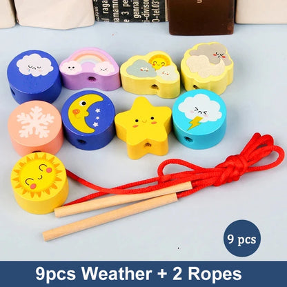 Colorful wooden beads featuring weather-themed designs like sun, clouds, and stars, with two red ropes.