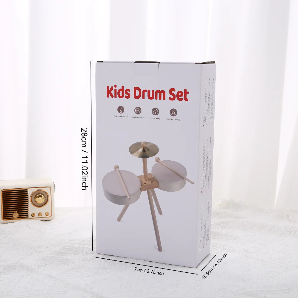 Kids drum set packaging featuring two drums and a cymbal, with dimensions printed on the side.