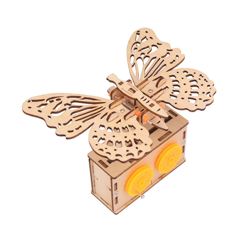 Wooden butterfly model with intricate cutouts, mounted on a base with yellow wheels for movement.