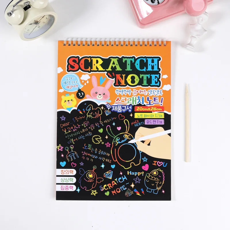 Scratch paper art kit with an orange cover, featuring colorful graphics and a drawing pencil.