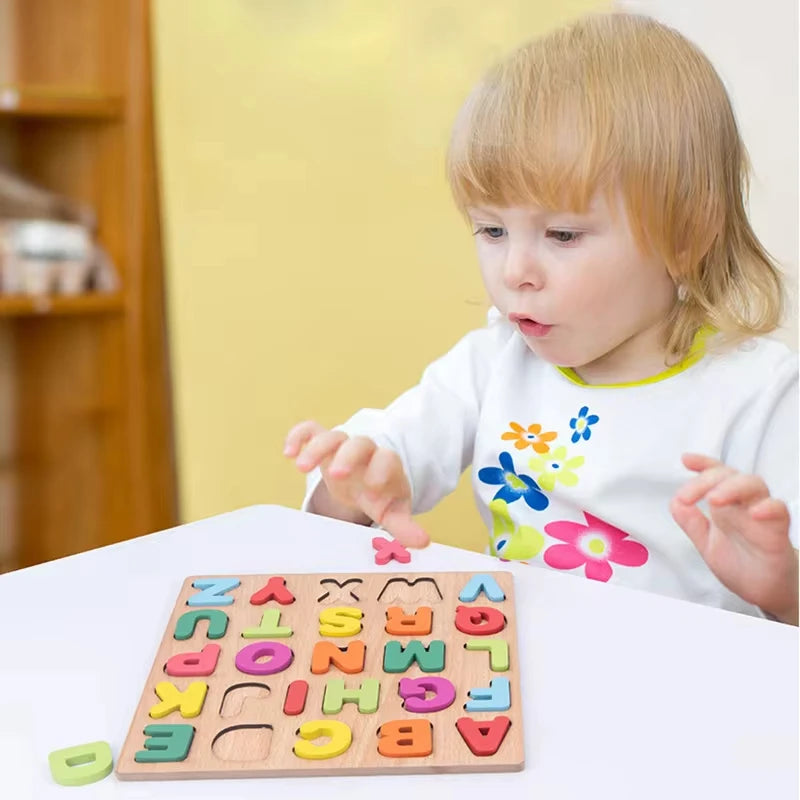 A toddler playing with a colorful wooden alphabet puzzle on a table, focused on matching letters.