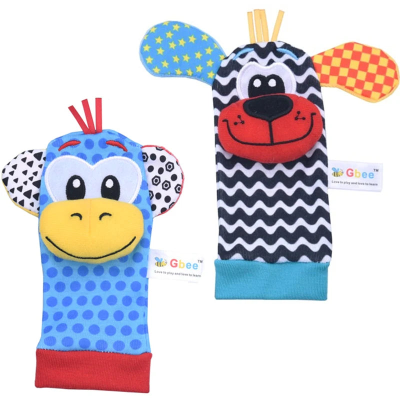 Two colorful baby socks designed as animal faces, featuring a blue monkey and a black dog with playful patterns.