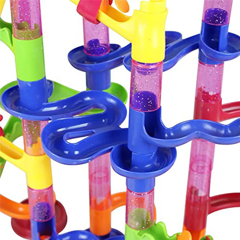 Colorful marble run track with transparent tubes and curved paths, designed for kids' play.