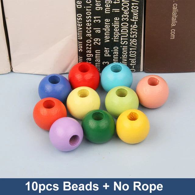 Ten colorful wooden beads in blue, red, yellow, green, purple, and orange arranged on a light blue surface.