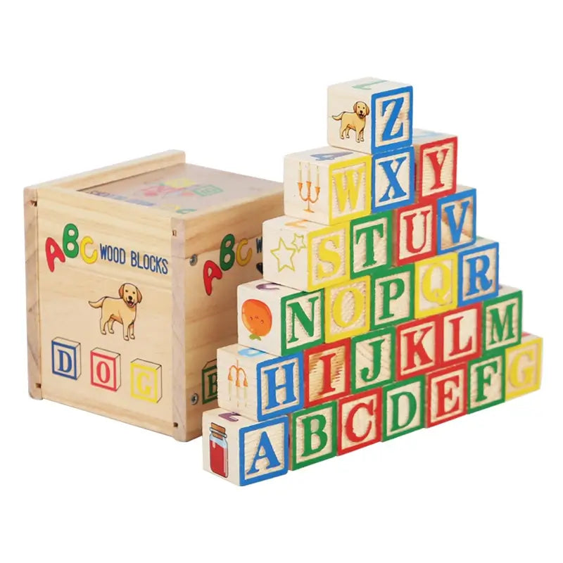 Stacked wooden blocks with letters and images, colorful design, next to a wooden storage box.