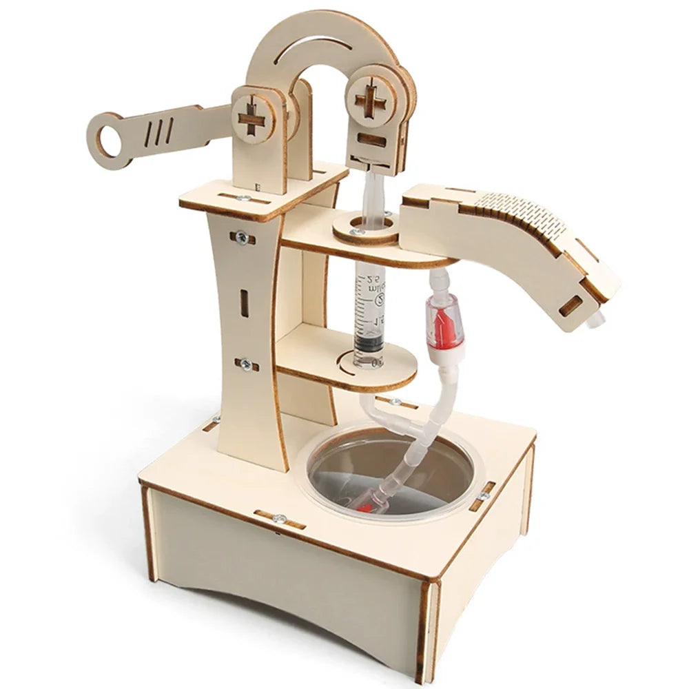Hand water pump toy made of light wood with a transparent tube and a container base for educational experiments.