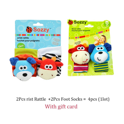 Two sets of baby wrist rattles and socks featuring colorful animal designs, packaged with a gift card.