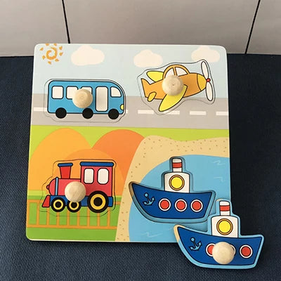 Wooden puzzle board featuring colorful vehicles: a bus, airplane, train, and boats with easy-grip knobs.