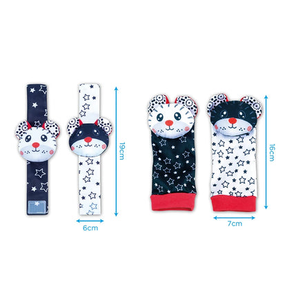 Four-piece set of baby wrist rattles and socks featuring animal designs in black, white, and red with star patterns.