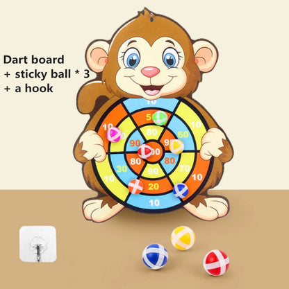 Monkey-shaped dart board with colorful target, three sticky balls in yellow, red, and blue, and a hook for hanging