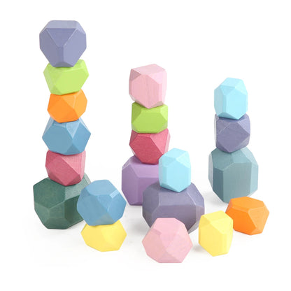 Colorful wooden stacking rocks in various shapes and sizes, suitable for toddler sensory play and learning.