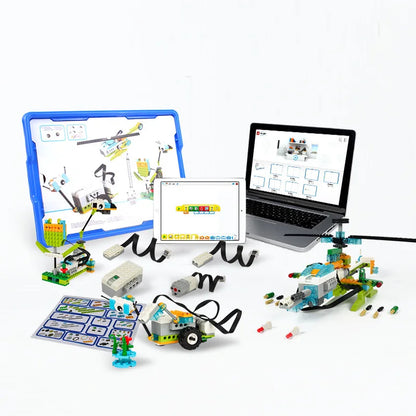Colorful robotics STEAM kit with building blocks, tablet, and laptop, featuring various assembled models and instructions.