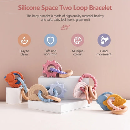 Silicone teether bracelet with two loops in various colors, featuring planet and star shapes, safe for babies.