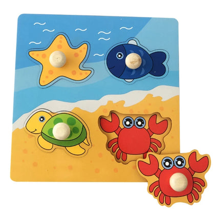 Colorful wooden puzzle featuring a starfish, fish, turtle, and crab on a beach background with knobs for easy handling.