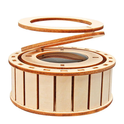 Wooden solar ring kit with a circular base and removable top, featuring slotted sides for assembly.
