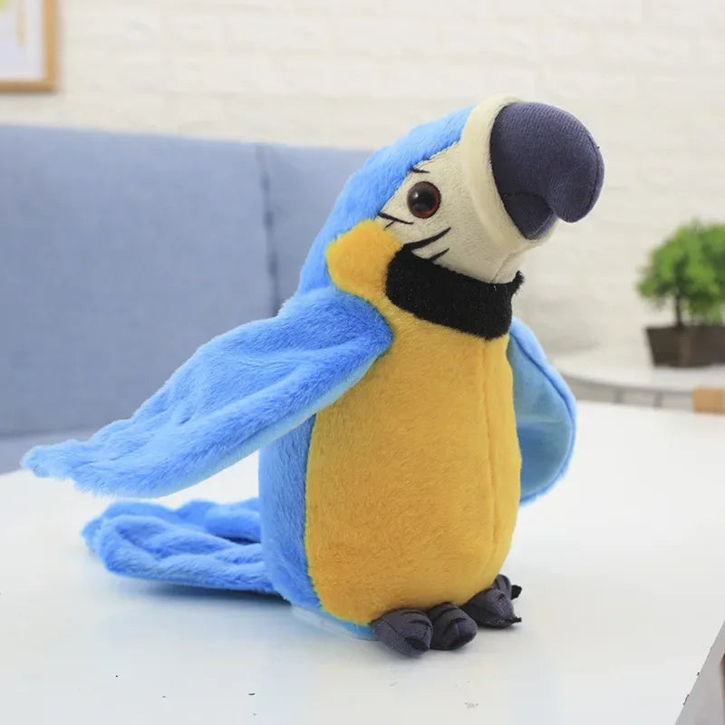 Blue stuffed macaw parrot plush toy with yellow belly and black beak, sitting on a table with greenery in the background.