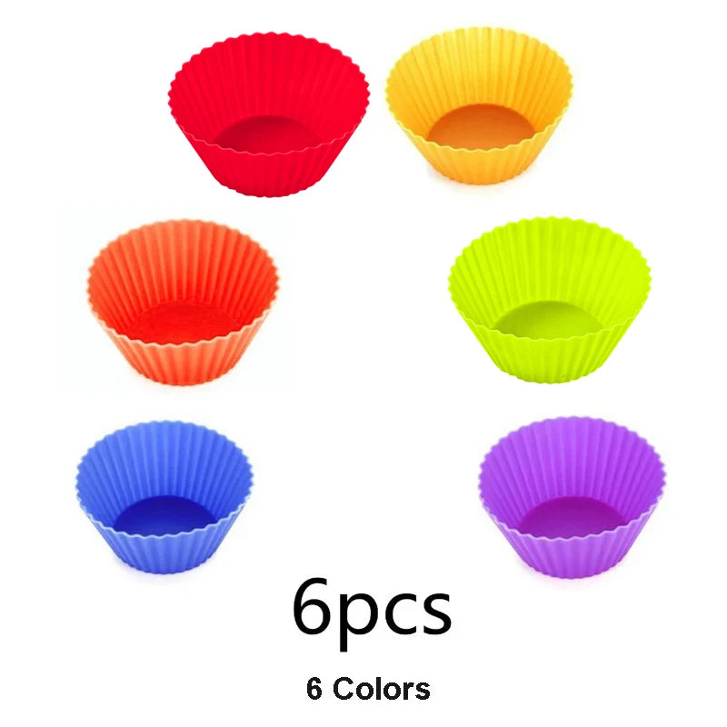 Set of six colorful plastic cups in red, orange, yellow, green, blue, and purple arranged in a playful pattern
