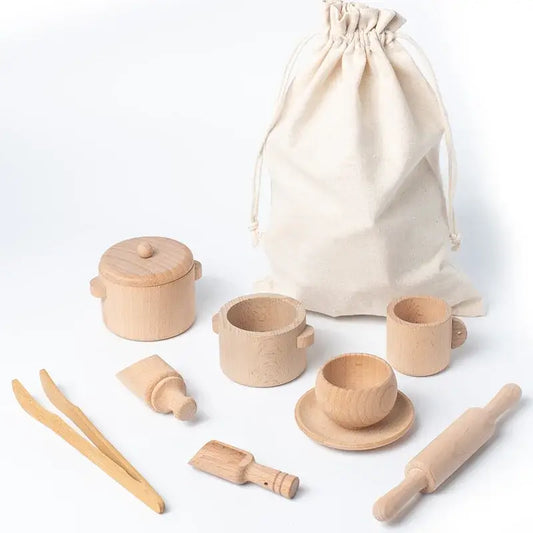 Wooden kitchen toy set including pots, cups, utensils, and a storage bag, designed for sensory play.