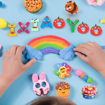 Colorful air-dry clay shapes including a rainbow, animals, and letters, with hands shaping clay on a blue background.