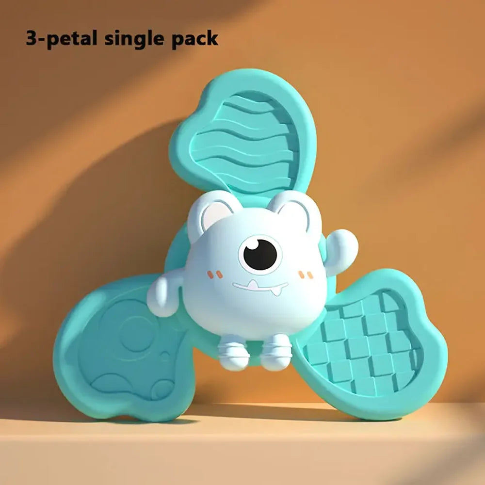 Colorful cartoon suction cup toy with a smiling face and textured petals, designed for baby bath play.